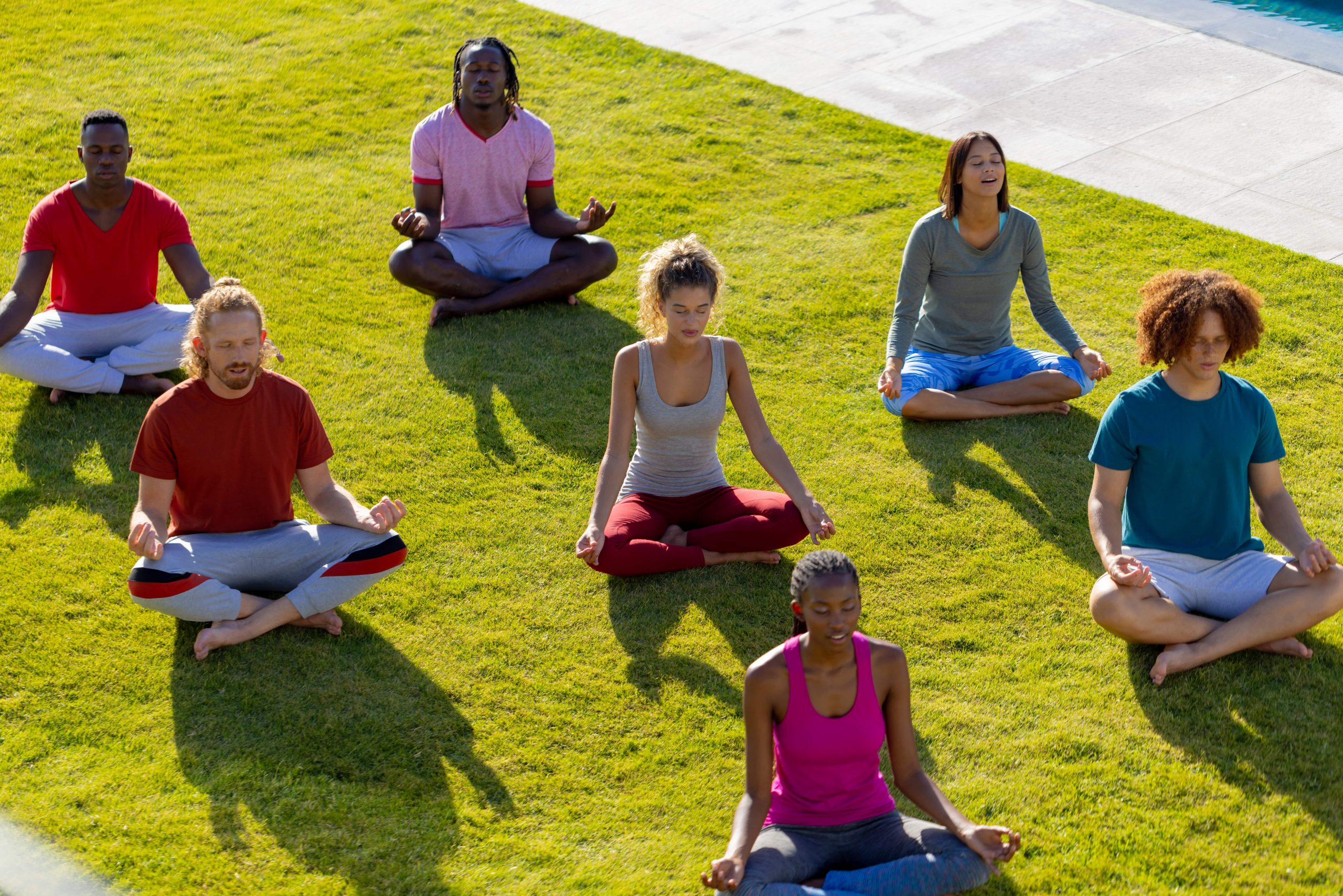 group-of-diverse-friends-doing-yoga-and-meditating